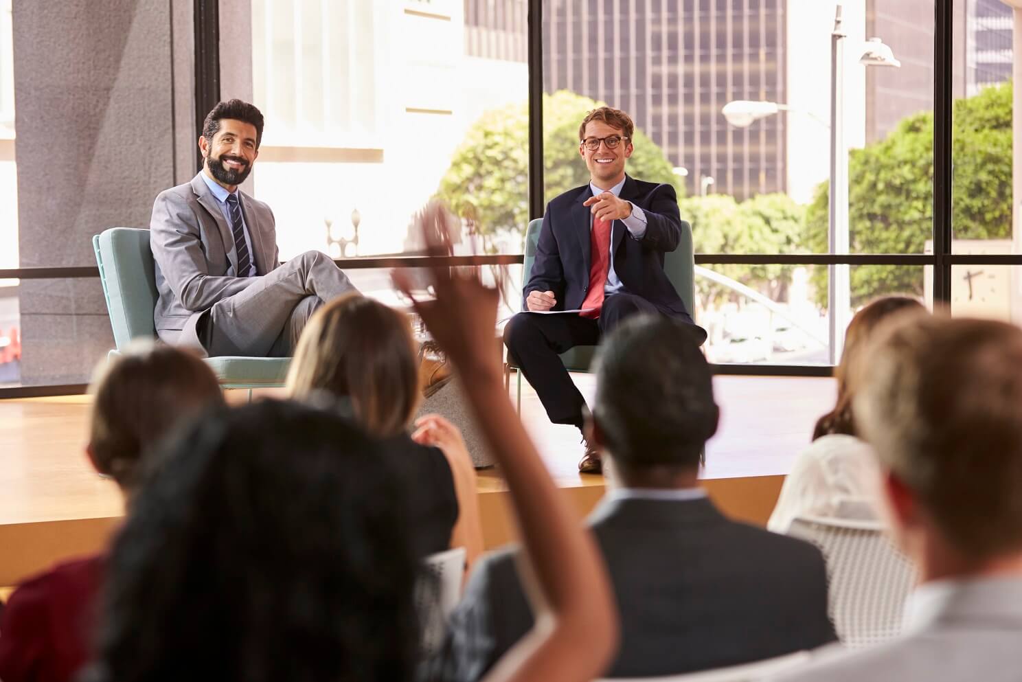 speakers-at-a-business-seminar-take-questions-from-PUD3F3G.jpg